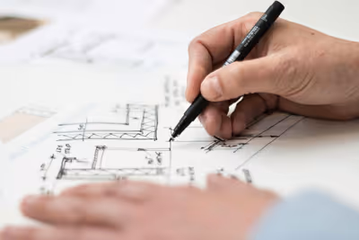 Pen with blueprint in the background